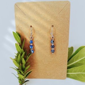 Blue evil eye dangle earrings